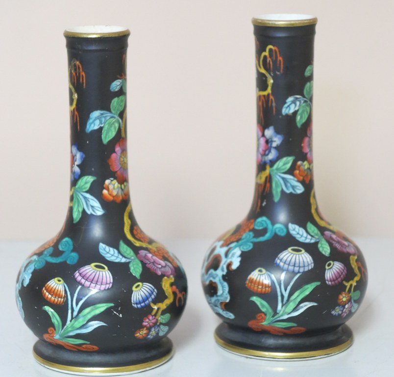 PAIR 19th CENTURY ENGLISH GARNITURE VASES: a pair 19th Century English baluster form Imari decorated vases with elongated necks. Each having a black glazed ground with polychrome flowering landscape deoration. Measures: 3½" Diameter x 7' H, e
