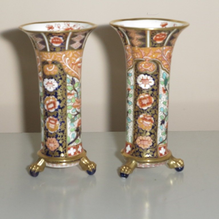 PAIR COPELAND GARNITURE VASES: A pair antique English Copeland polychrome Imari porcelain and parcel gilt decorated footed quadrilobed vases. The scalloped rims with interior floral decoration. The whole raised on gilt tripod ball 