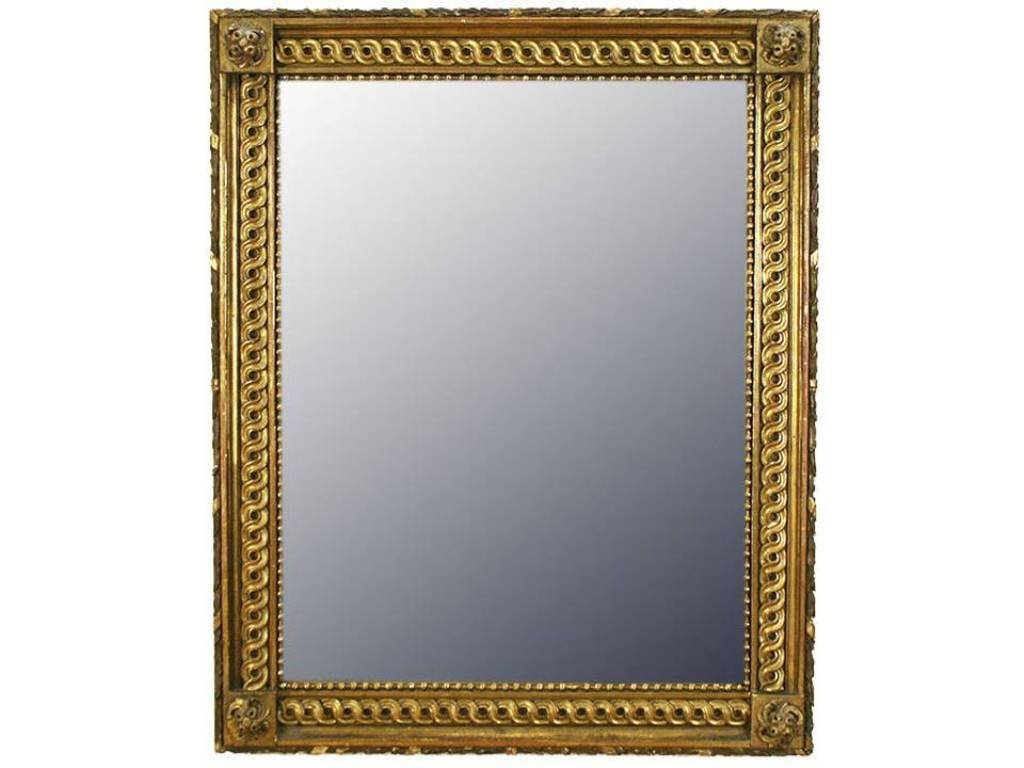 ITALIAN LXVI STYLE CARVED GILTWOOD MIRROR:: Italy 2nd Half 19th Century entirely of carved wood and of rectangular form, the outer edge with spaced gold ribbons wrapping around the carving, the corners with raised carved twisting rosettes cente