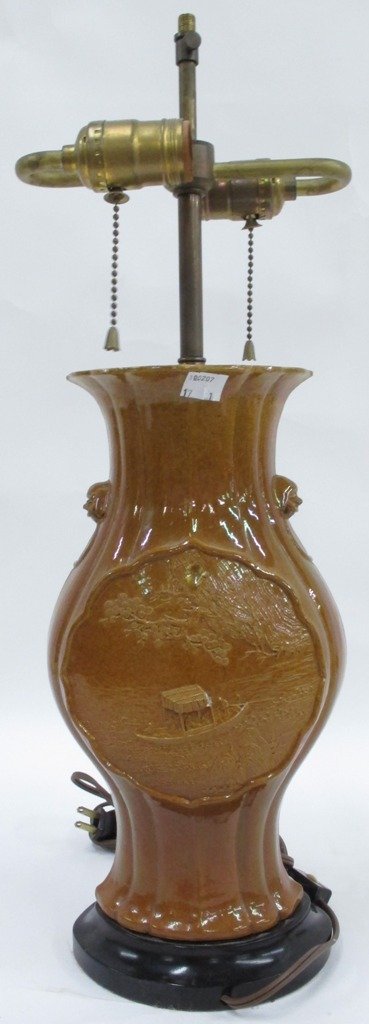 CHINESE PORCELAIN LAMP:: A Chinese Porcelain Lamp. 20th century, the lamp having two lighting elements and of baluster form with two center cartouches, the first depicting men on a boat and the second a rural village.