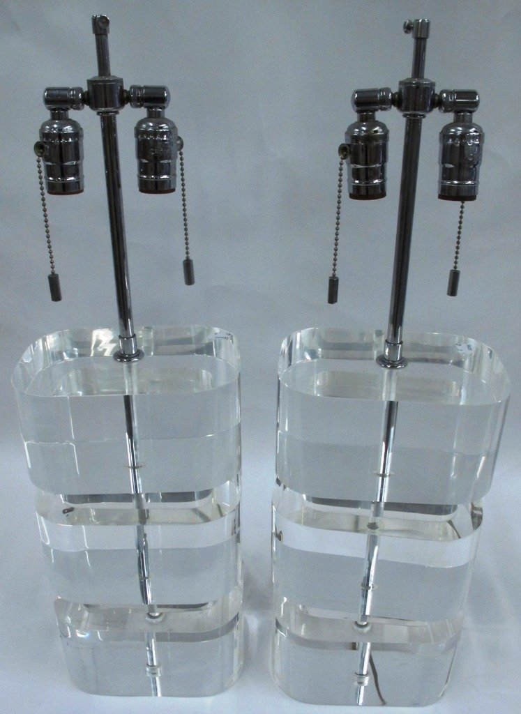 ATTRIBUTED TO KARL SPRINGER LUCITE TABLE LAMPS:: A Pair of Lucite Table Lamps, Karl Springer, each having two lighting elements attached to the chrome standard with three horizontal rectangular segments. Approximately 14.75"H.