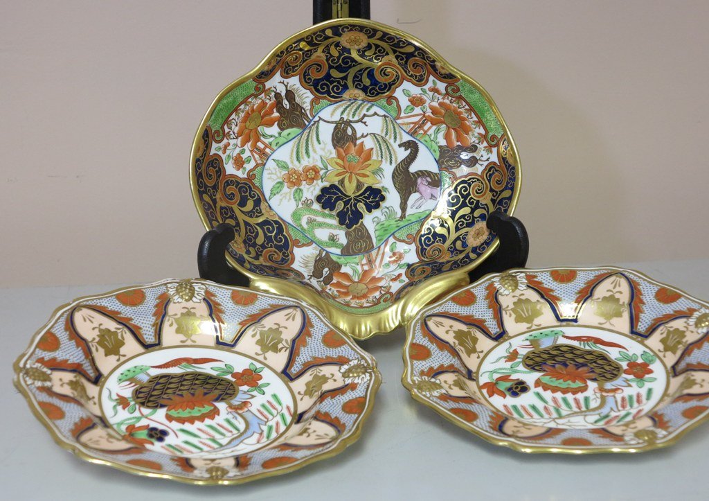 GROUP OF ANTIQUE ENGLISH IMARI PORCELAINS: A oair 19th Century English Ridgway Imari porcelain scalloped octagonal dessert plates with raised berry decoration along with a 19th Century English Imari patterned shell form dish with heavy gilt ha