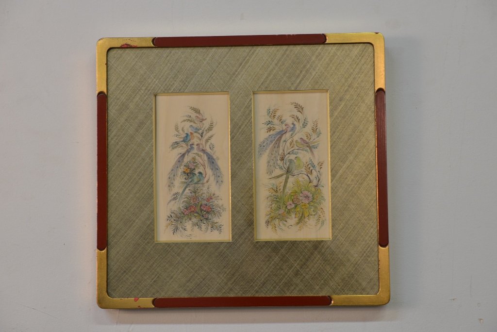 PAIR CONTINENTAL SCHOOL INK & WATERCOLOR PANELS:: Ink and watercolor on ivory or celluloid panels depicting plumed birds in a naturalistic setting. Frame measures 13.5" X 14.25"; each panel measures 7.25" X 3.75".