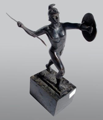 LUDWIG GRAEFNER (GERMANY, 19TH/20TH CENTURY):: Classical Warrior in Battle, bronze, depicting a young male preparing to throw his sword, the statue with deep black patination, signed L Graefner (on base). Pitting note to surface of statue. Height
