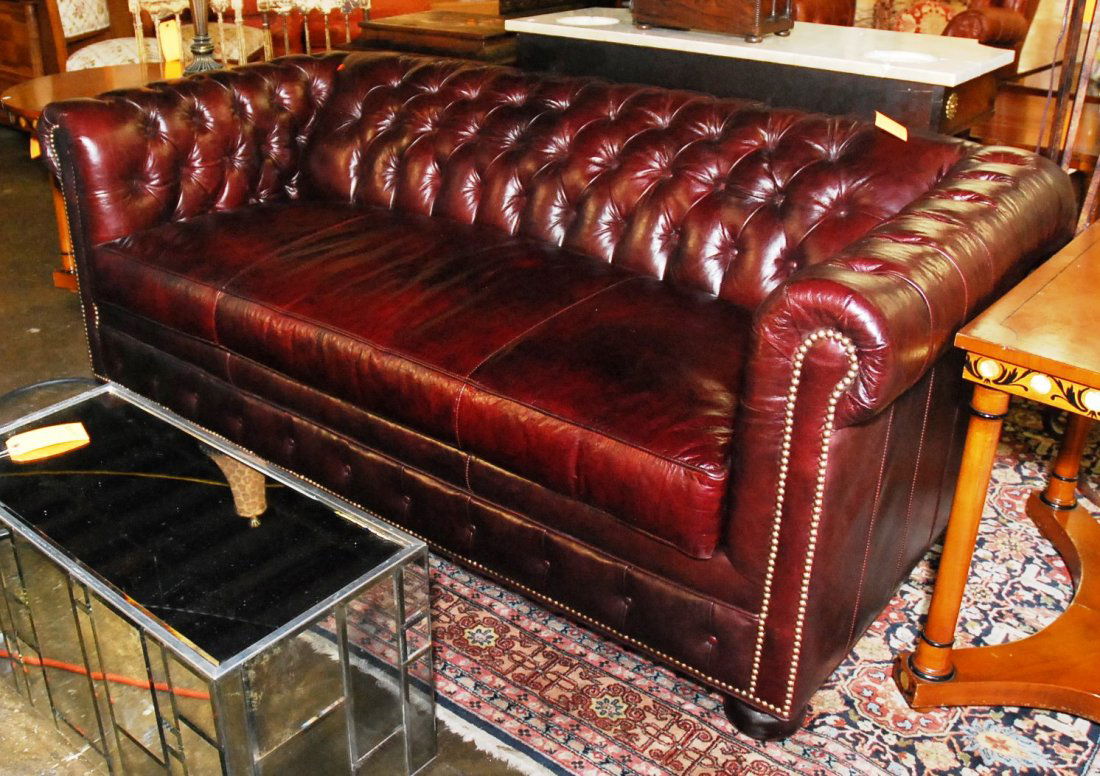BURGUNDY LEATHER SOFA:: Pull out bed, single sided leather cushion. Very good cushion. 29"H X 75"W 36"D