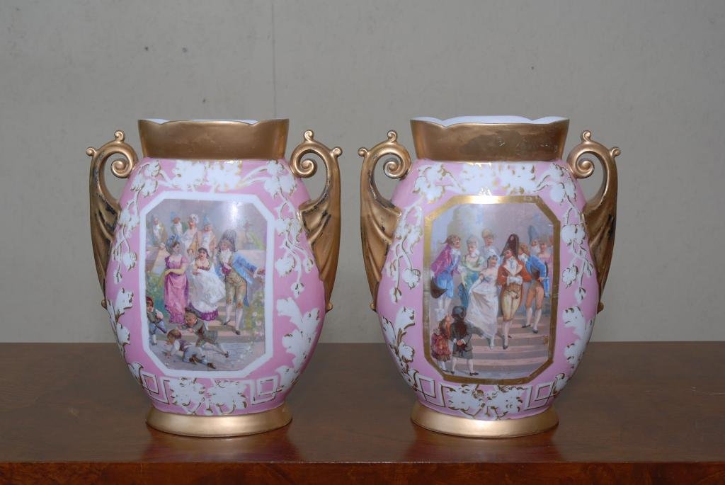 PAIR 19TH CENTURY ENGLISH VASES: Pair of 19th Century English two handled vases with transferware genre scene on one side and flowers on reverse. Bottom unmarked. 13" H X 10" H X 4.5" D