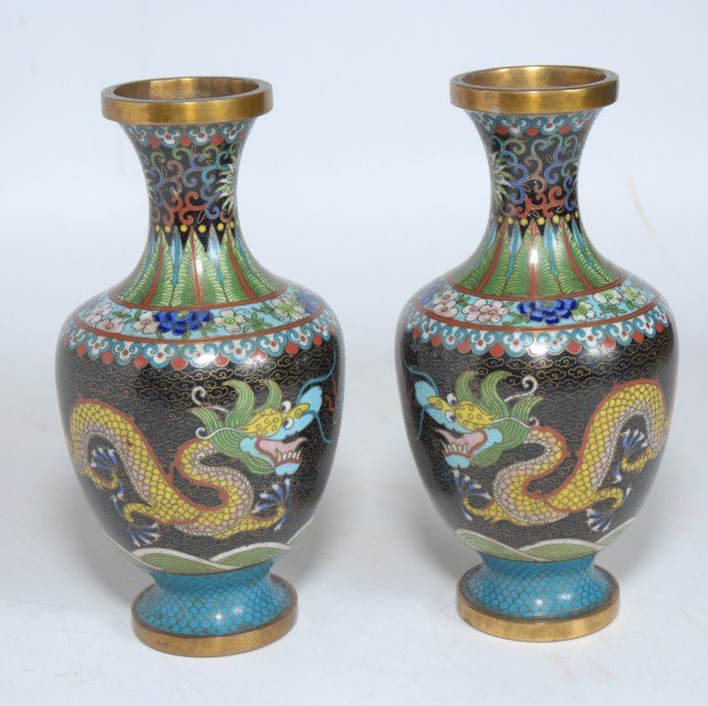 A PAIR OF CHINESE CLOISONNE VASES:: 20th century, of baluster form having floral and foliate decoration on the neck above repeating yellow dragon decoration, raised on a circular foot. Overall good stable condition with no apparent loss