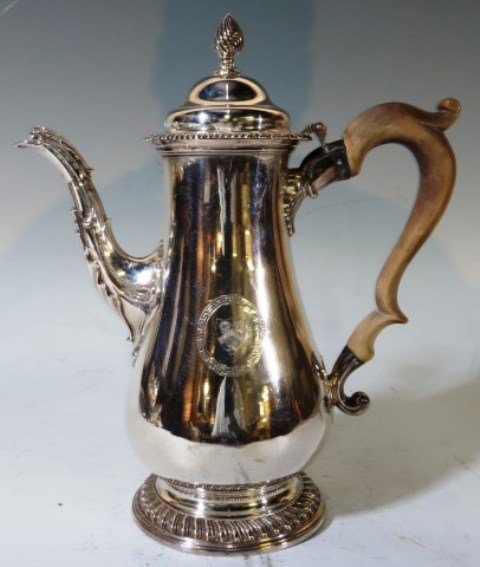 ENGLISH STERLING CHOCOLATE POT 1793: 19th century Sterling cholcolate or coffee pot wood wood handle with medallion designs. 10 3/4" H X 4 1/2" Dia. Base. Good condition. illegible makers mark WG?, London mark, 1793 date code. Weight wit