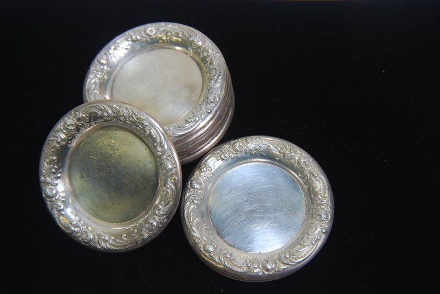 TWELVE STERLING COASTERS: 9.7 Troy Oz Provenance: From a fine New Canaan, Connecticut home.