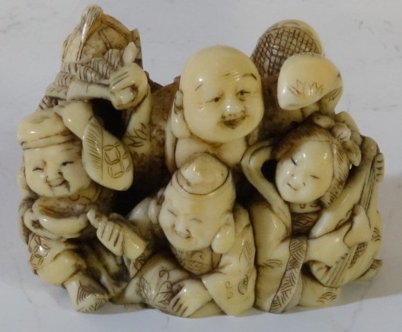 CARVED IVORY NETSUKE SEVEN SCHOLARS: Later 19th/ Early 20th century. Finely carved. 1 1/2"H X 2"W