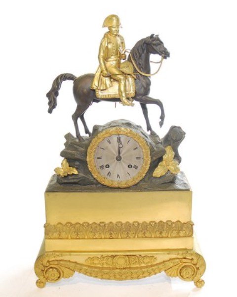 FRENCH GILT BRONZE MANTLE CLOCK: Gilt bronze mantle clock depicting Napoleon on horseback with sword on four splay feet. Steel engraved face dial. FC? mark on clock. Otherwise no marks found. 17 1/2"H X 11 1/2"W X 4"D Note: Missing b