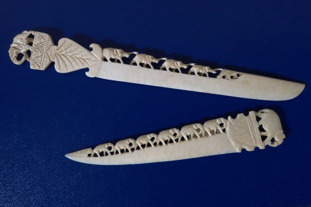 TWO CARVED IVORY LETTER OPENERS: Each with elephant motif. One 5" and one 7"
