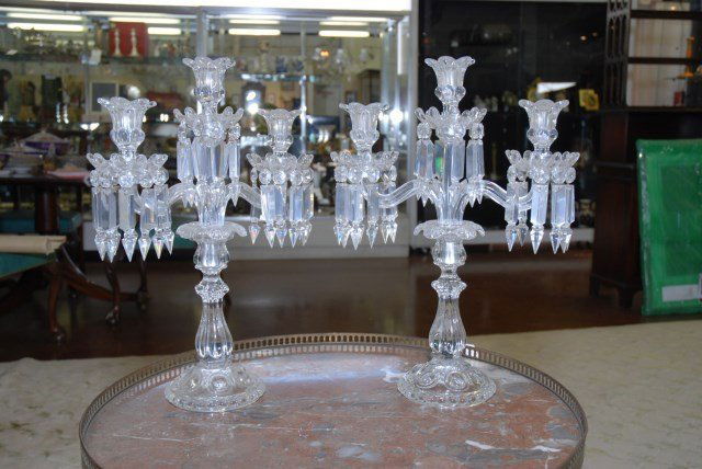 CRYSTAL CANDELABRAS: Two arm crystal candelabras with three candle holders on a round base. 17 3/4" H X 12 1/2"W X 4 1/2" dia, base