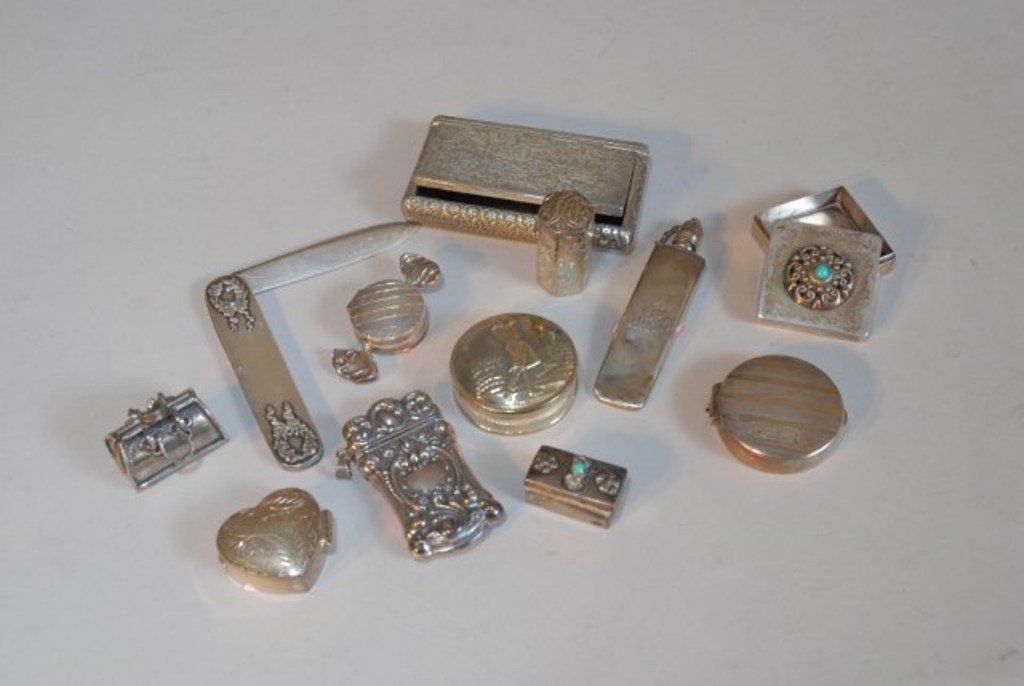 COLLECTION OF SILVER PILL BOXES: Twelve miscellaneous sterling objects comprised of match safes, pill boxes, snuff box, knife, perfume flask, compact.