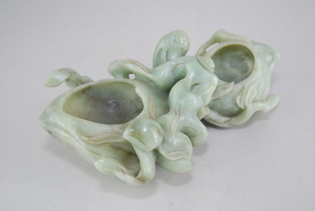 YONG ZHENG JADE BRUSH PEN WASHER: Relief carved in the form of plums entwined in foliate vines. 3 1/2"H X 10 3/4"L