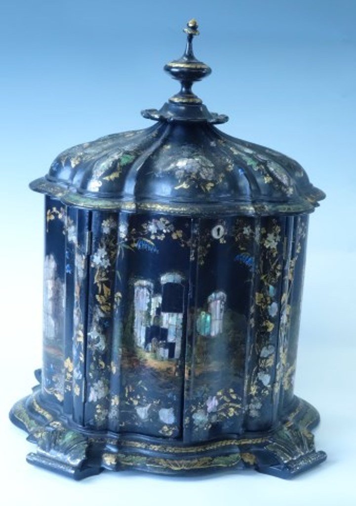Victorian Ladies jewelry cabinet: 19th Century Crenstincted of black lacquered papier mache with gilt decoration and mother of pearl inlay. Having a hinged domed top with trimmed finial above two doors. All opening to an elaborate dra