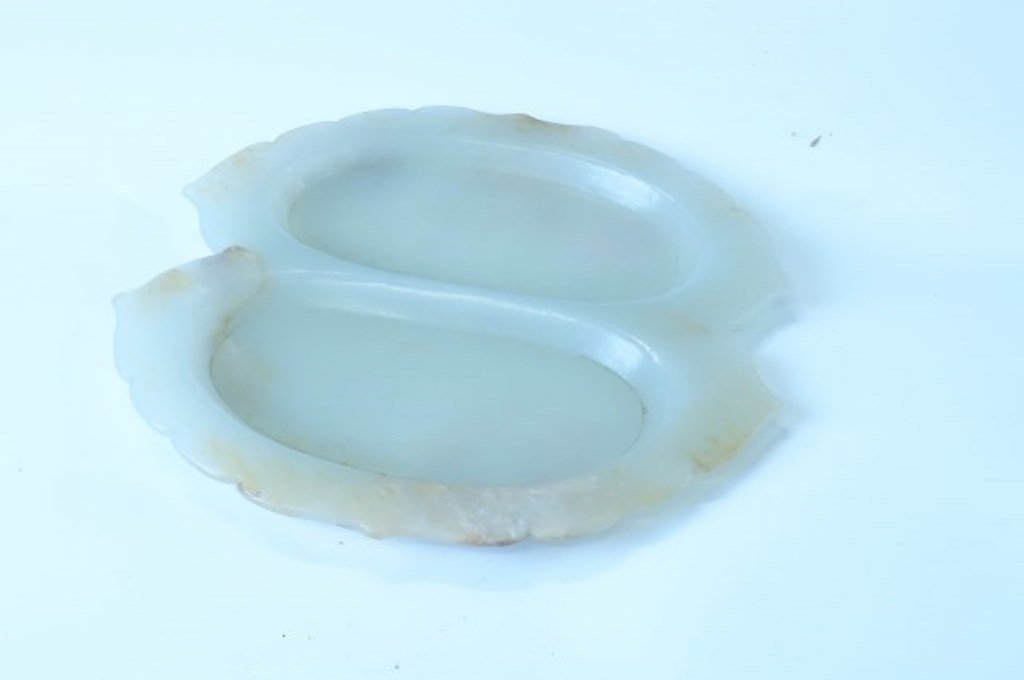 Jade Double Brush Washer: The stylized foliate form dish carved with two shallow reservoirs from a light green jade. 6 1/2"H X 6 1/2"W