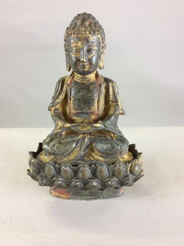 Chinese Gilt Bronze Buddha With Lotus Crown Base: Gilt Bronze Buddha, Late Ming Period, trace of gilt over Darkened Purple bronze patina, separate base of Double Lotus Throne. Showing Carved Sacred Swastika Symbol on Chest. Serene Face, Hands in Dhya