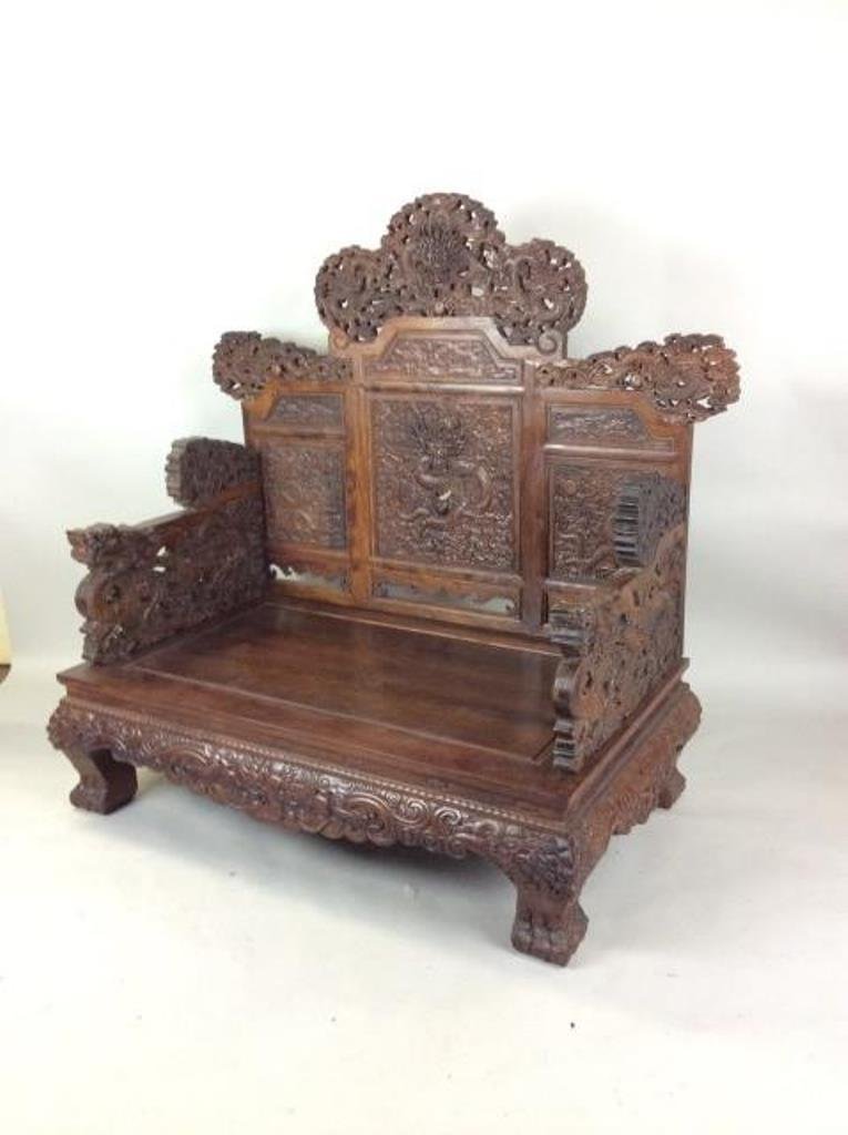 Chinese Antique Large Throne Chair: Having dense hardwood throughout, composed Huang HuaLi wood with a fine grain, elaborately carved surface-with dragons, foliages, stylized floral scrolling and rococo elements, through out Back Splat,