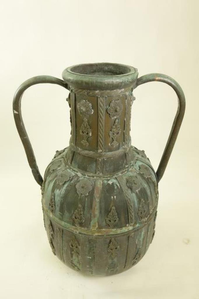 Large Middle Eastern Copper Vessel: 19th / 20th Century The large vessel having applied handles, florets and tree form decoration. 35 1/2"H X 26'D