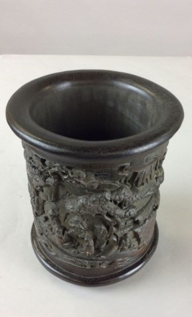 Carved Bamboo Brush Pot: China, Antique Chinese relief carved bamboo brush pot depicting. a landscape scene with wisemen and attendants approaching a ferryman on boat, Rock formations and pine trees can also be seen. Calligra