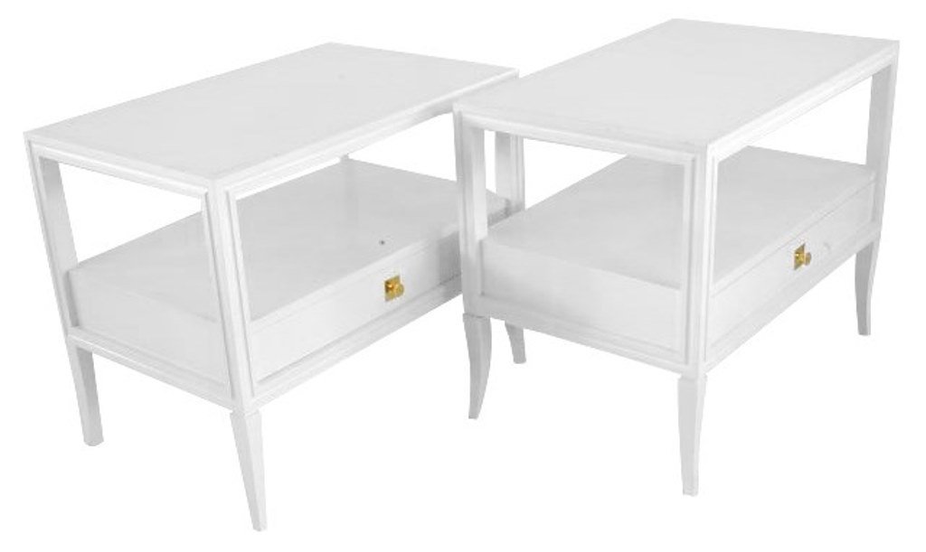 Pair Tommi Partzinger End Tables: A pair of mid 20th Century modern white lacquered night tables designed by Tommi Parzinger. The rectangular tops, having conforming white glass inserts, above an open shelf compartment over one long d