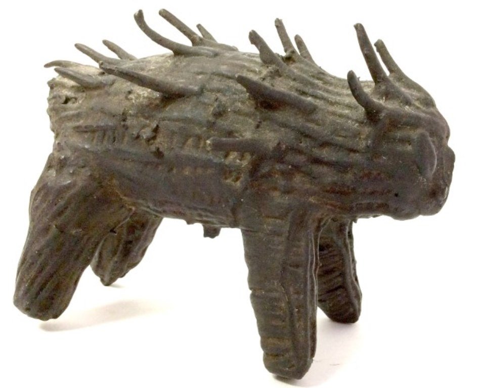 Nigerian Sculpture: A 20th Century semi antique African black patinated bronze figure of a porcupine. 6"L X 3½"W X 4"H Provenance: A fine upper west side Manhattan home. 6"L X 3½"W X 4"H
