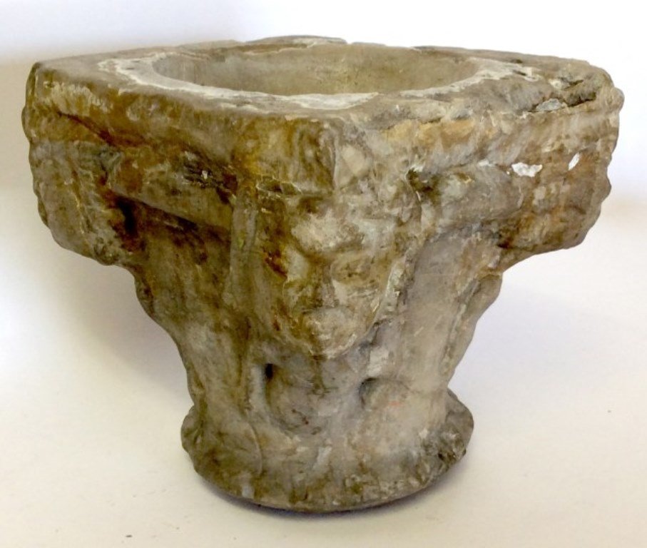 French Medieval Fragment: A 14th Century French carved stone church column capital comprised of four grotesque figural corner elements. Measures: 8" L X 8" W X 8" H. Condition: Commensurate with age and use. Provenance: A fine