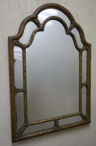 Semi Antique Carved Mirror: Arch crested semi antique mirror in carved frame with a foliage pattern. Remnants of gilt and paint.41 1/2"H X 24"W