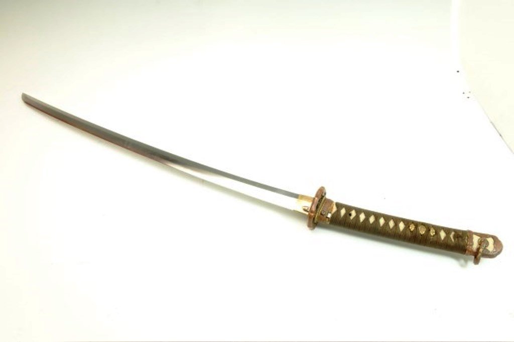 Japanese Sword Signed Metal Scabbard: Shark skin handle with Minukis.and decorative pommel. Metal Scabbard. Signed Blade Overall with scabbard: 40 3/4" Exposed blade: 28" to hilt