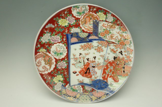 Imari Japanese Charger Late 19th C: Circa 1890 charger with blue seal mark. Depicting a woman pinning hair. 2"H X 16"W