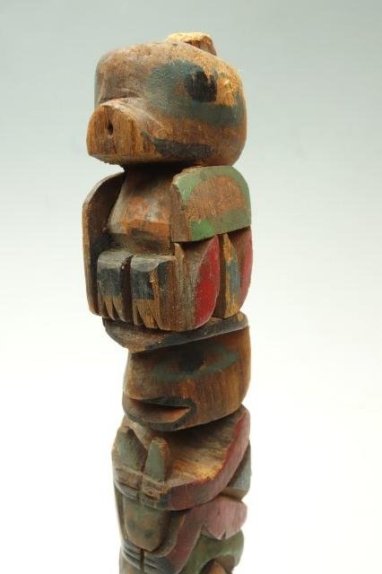 Pacific Northwest Native American Totem: Wood carved totem 10 3/4"H X 1"W Note: Minor losses
