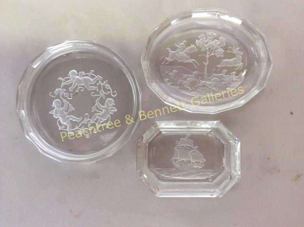 Collection Signed Hoffman Objects: All acid etched and engraved. Depicting cherubs, hunting scenes, sailing vessels. 19 coasters, dishes etc. 2" to 3 1/2" Note: one small item has chips.