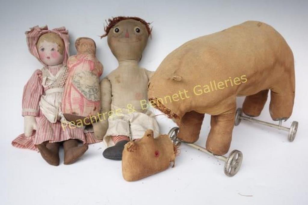Group Cloth Dolls: Includes Raggedy Ann with painted face, a cloth pulled rhinoceros on wheels (in poor condition), two cloth painted dolls. Raggedy Ann measures15.5 H" X 3.5" L