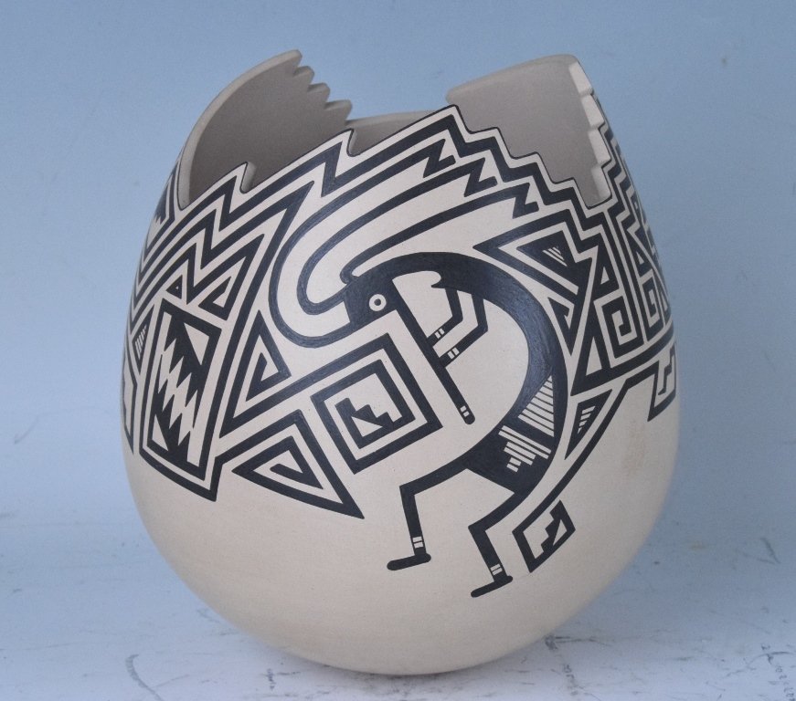 Luis Armando Rodriguez Vase: Egg form vase with geometric rim, the vase with a cream ground with geometric designs. Signed to base. 7 3/4 inches height, 7 inches diameter. Good condition. 7 3/4"H X 7"Dia