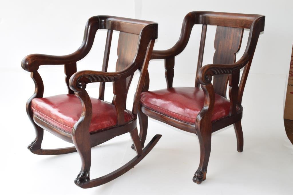 Empire Arm & Rocking Chair: Empire arm chair and matching rocking chair having red leather seats, scroll carved arms, with front paw feet height 38 inches, width 25.5 inches, depth 24 inches Note: Rocking chair has stable crack