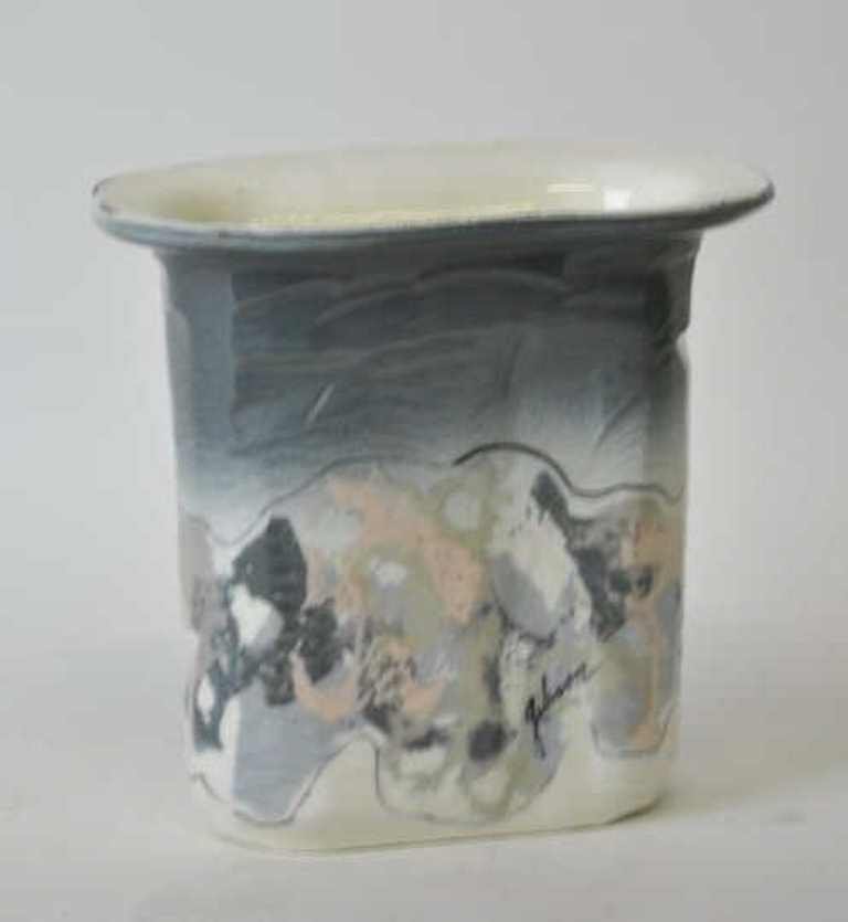 Gibson Signed Porcelain Vase: painted in an abstracted landscape and signed “gibson” on the side. 6.75 inches height, 7 inches width, 4.25 inches depth. 6.75"H x 7"W x 4.25"D 6.75"H x 7"W x 4.25"D