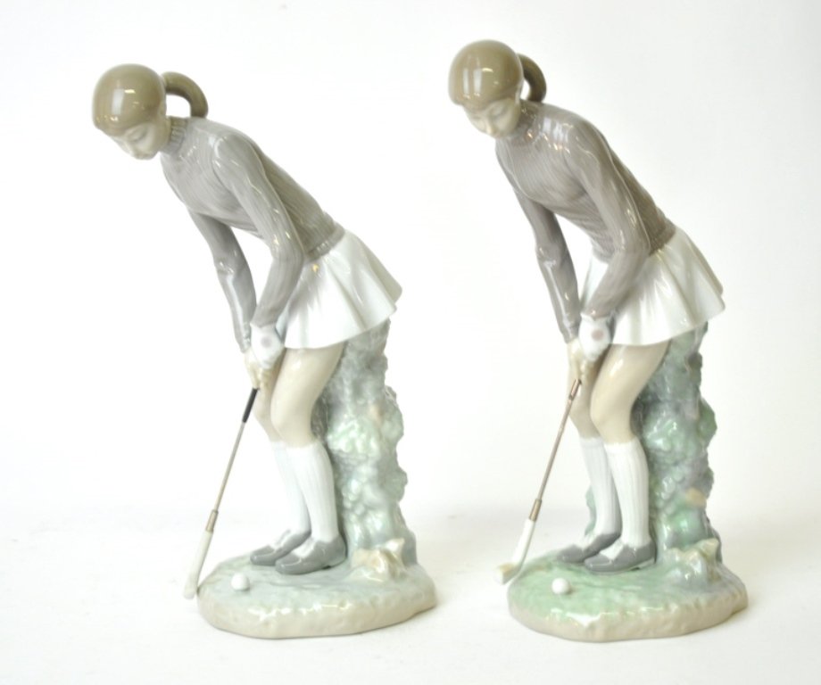 2 Lladro Porcelain Figurines: Both depict a woman golfing in a brown sweater and white skirt, however they differ slightly in the woman’s lean and the position of her hands and the foliage support behind her. One is slightly sho