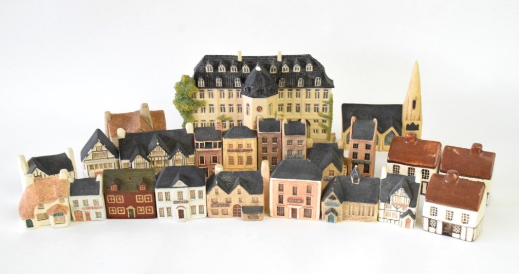 Group 23 British Porcelain Buildings: Group of small building models of porcelain, most by Philip Laureston, three with unclear marks, one by Little Bavaria in Ireland. Group includes a mansion, cottage homes, and buildings marked “muse