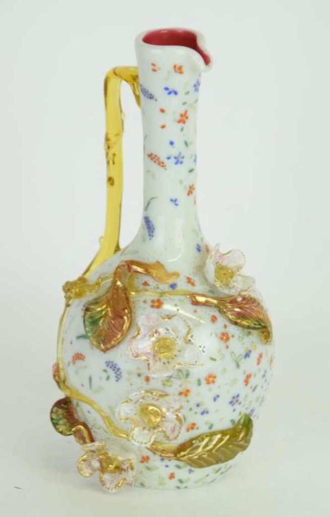 Thomas Webb (Attr.) Enameled Bottle Vase: Fine enameled glass pitcher form bottle vase having amber handle and applied floral decoration in various glass colors, exterior of bottle vase enameled and parcel gilt in a floral motif. Vase in good