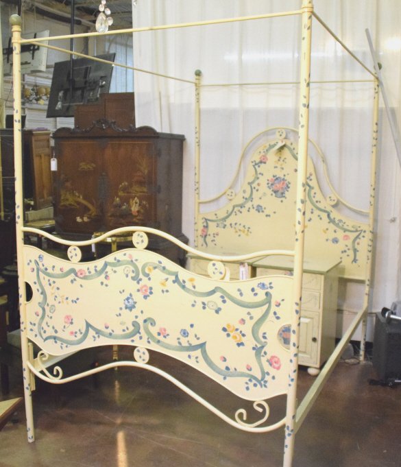 Painted Metal Four Poster Bed: Metal four poster bed in yellow paint having floral decoration. 83 inches height, 79 inches length, 54 inches width.
