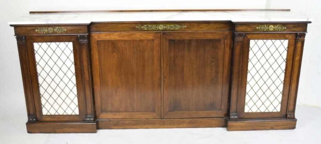 Kittinger Marble Top Regency Style Sideboard: White marble top with gray veins having a beveled edge over a four door cabinet front, each fitted with interior shelves. Bronze mounts about each cabinet in foliage motif. 37.5 inches height, 90.5 in