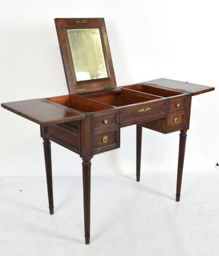 French Poudruese: Flip top vanity having center mirrored panel. Faux drawer front and raised on four tapered reeded legs. 47 inches height, 49 inches width, 17.5 inches depth. 47"H x 49"W x 17.5"D. Minor losses to fini