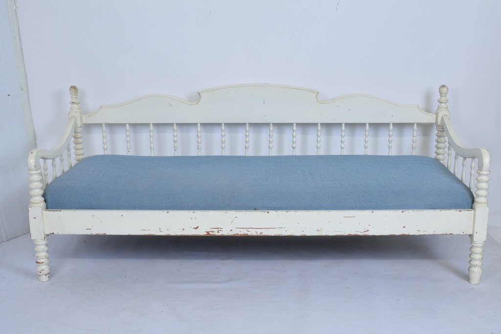 American White Painted Daybed.: Day bed having white painted frame and blue upholstered cushion seat. Frame having spool turned supports. 30 inches height, 73 inches width, 26.5 inches depth 30"H x 73"W x 26.5"D. Some paint loss. Me