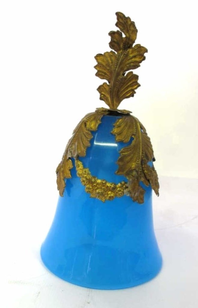 Blue Opaline Glass Bell: Opaline blue glass bell body with repousse leaf and floral swag motif handle and ringer. 6 inches height, 3.25 inches diameter. Good overall condition. 6"H x 3.25"Dia. Good. 6"H x 3.25"Dia.