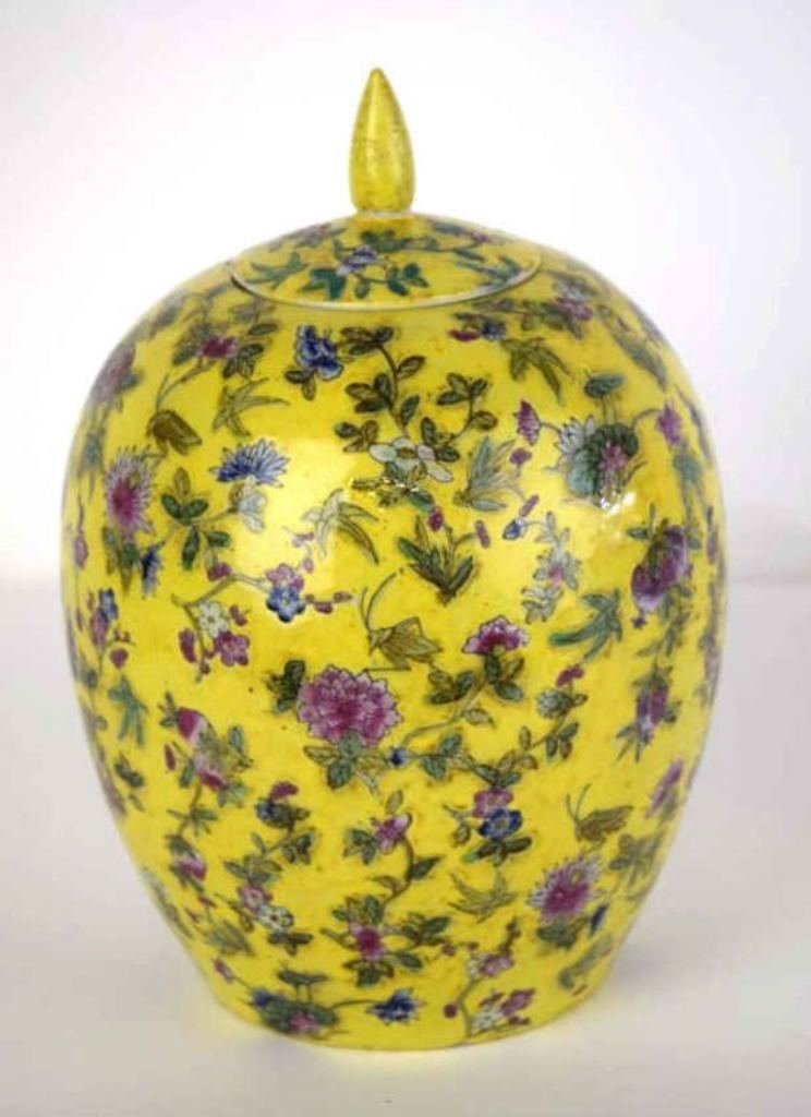 Chinese Yellow Porcelain Ginger Jar: Ginger jar with yellow ground and floral motif underglaze. Marked on underside. 11.5 inches height, 7 inches diameter. 11.5"H x 7"Dia. Good condition. 11.5"H x 7"Dia.