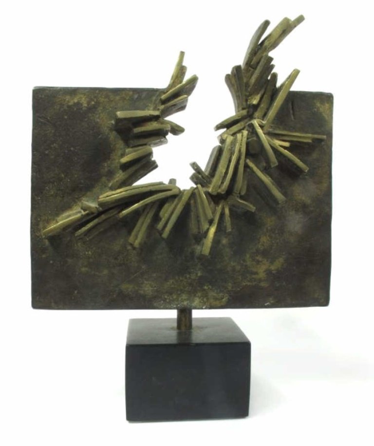 Feliciano Signed Bronze Sculpture: Flat, plaque shaped bronze sculpture with an impact or explosion design at center top edge. Mounted onto an ebonized wood base. Signed "FELICIANO" front lower right. 12 inches height, 8.25 inches widt