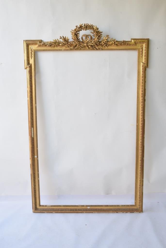 Antique Gilt Picture Frame: Antique gilt gesso picture frame having beaded surround with floral and wreath decoration at top height 68.5" width 44" Note: loss beaded surround 68.5" H x 44" W loss to edge