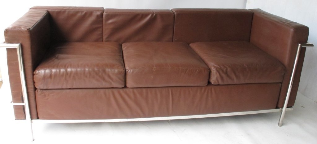 Brown Leather Modern Couch: Modern couch with steel frame. Having cushions upholstered with brown leather. 28.5 inches height, 74 inches width, 28 inches depth. 28.5"H x 74"W x 28"D Good overall Seating 28.5"H x 74"W x 28"D Good