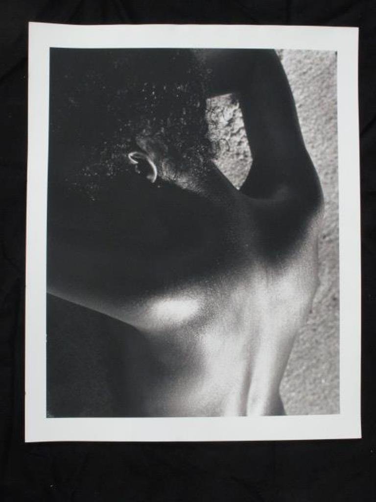 Michel Comte (1954-) Black and White Print: Black and white photographic print on baryta paper by acclaimed photographer Michel Comte. Depicting a woman's upper back and neck from behind. Artist's marks in pencil to verso. 20 inches height and